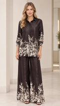 Front full view of women's floral satin two-piece set in black with collared shirt and wide-leg pants