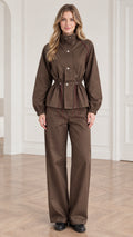 Front view of woman wearing brown utility windbreaker jacket and matching wide leg pants