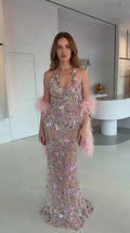 Front view of model wearing Blush Pink floral embellished halter evening gown with pink feather stole