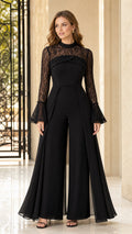 Front view of woman wearing elegant black lace mock neck wide-leg evening jumpsuit with chiffon overlay
