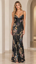 Front view of model wearing black floral print satin spaghetti strap maxi dress