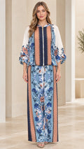 Front view of model wearing Light Blue floral print zip blouse and wide-leg pants set