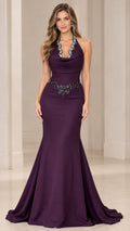 Front view of model wearing eggplant halter neck mermaid evening gown with beaded neckline
