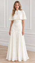 Front full view of woman wearing white collared lace capelet maxi dress