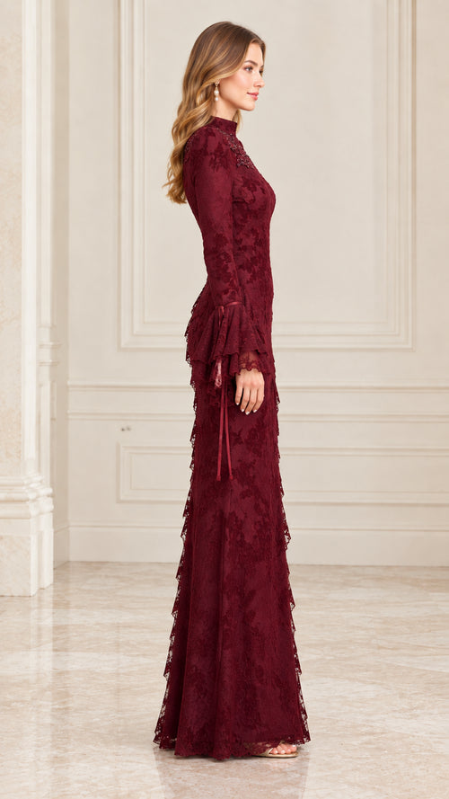 Side view of woman wearing burgundy floral lace long evening gown