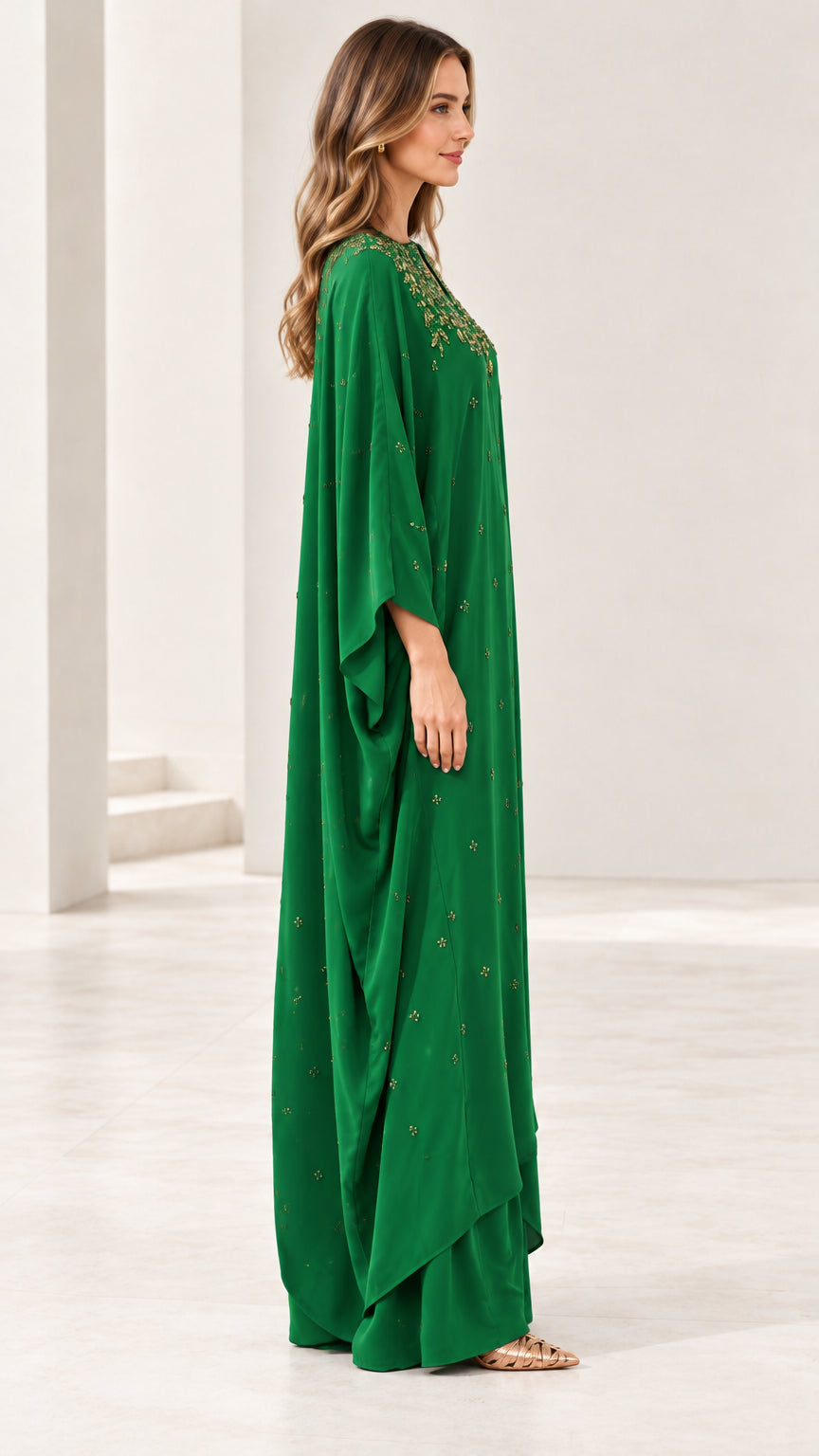 Side profile view of emerald green draped kaftan maxi dress