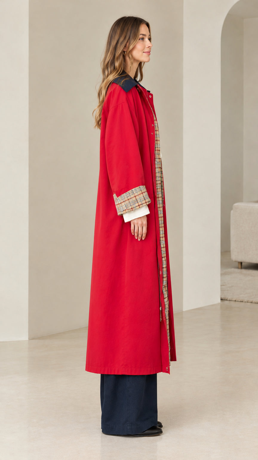 Side profile view of red long duster trench coat