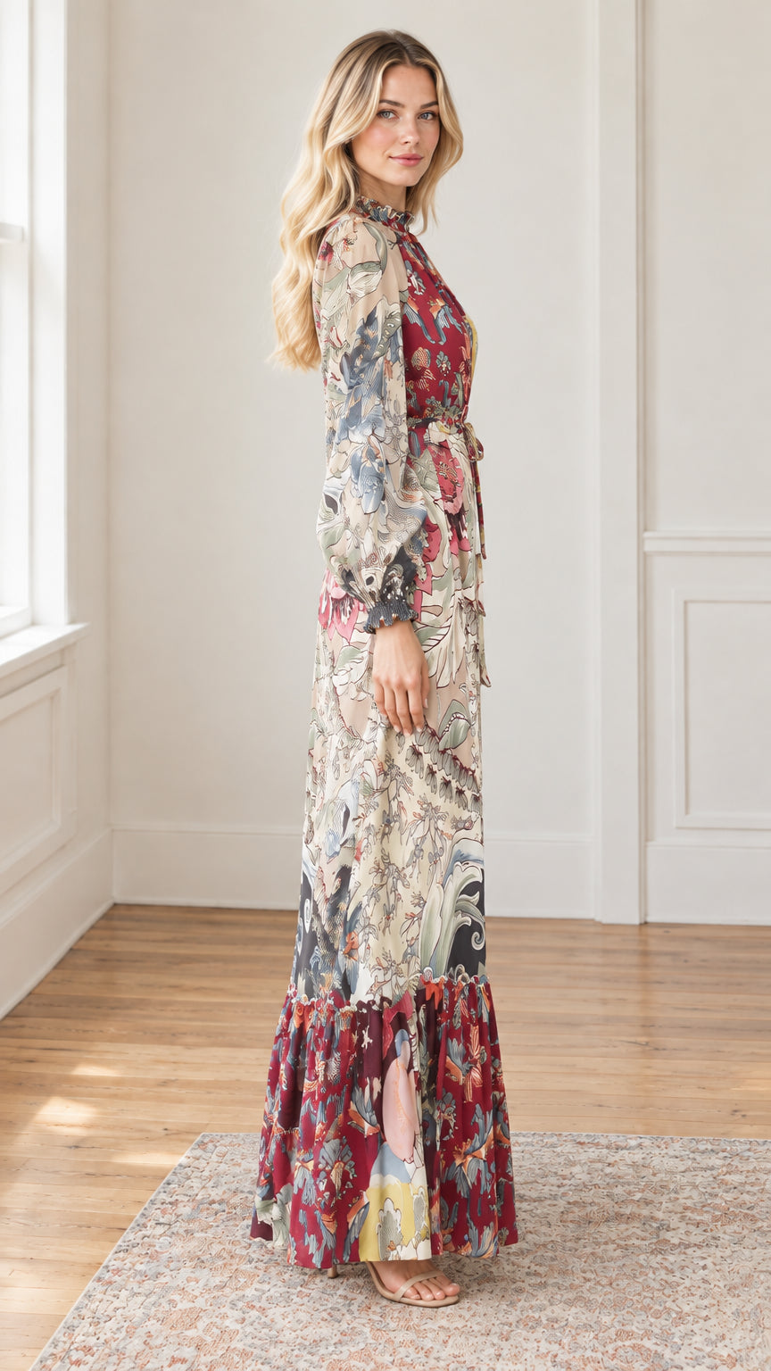 Side profile of woman in flowing botanical print high neck maxi dress