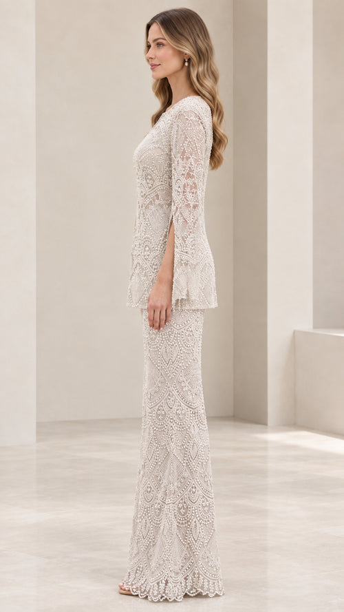Side view of woman wearing champagne lace tunic and flared pant suit