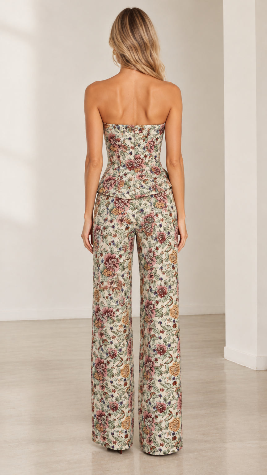 Back view of model in cream floral tapestry two-piece peplum pants set