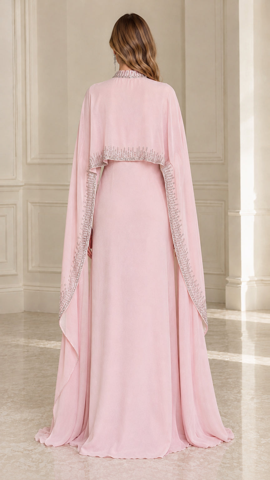 Back view of Blush Pink formal dress highlighting the flowing cape overlay and beaded trim