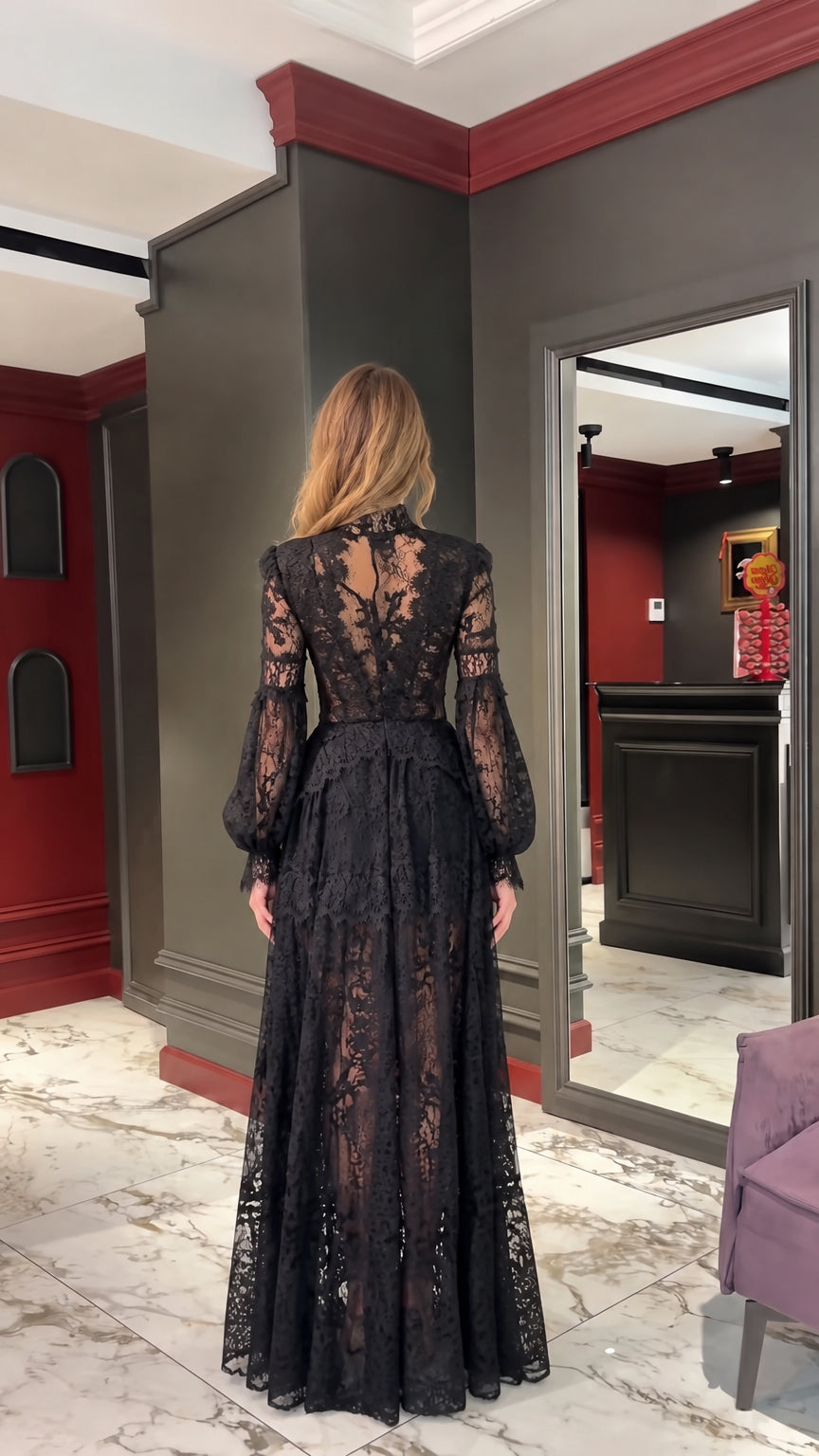 Back view of woman wearing Black high-neck floral lace maxi gown