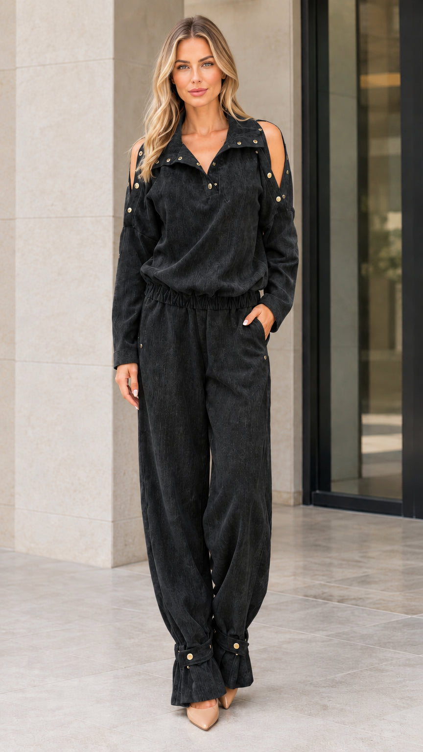 Full front view of model wearing Black cold shoulder utility jumpsuit