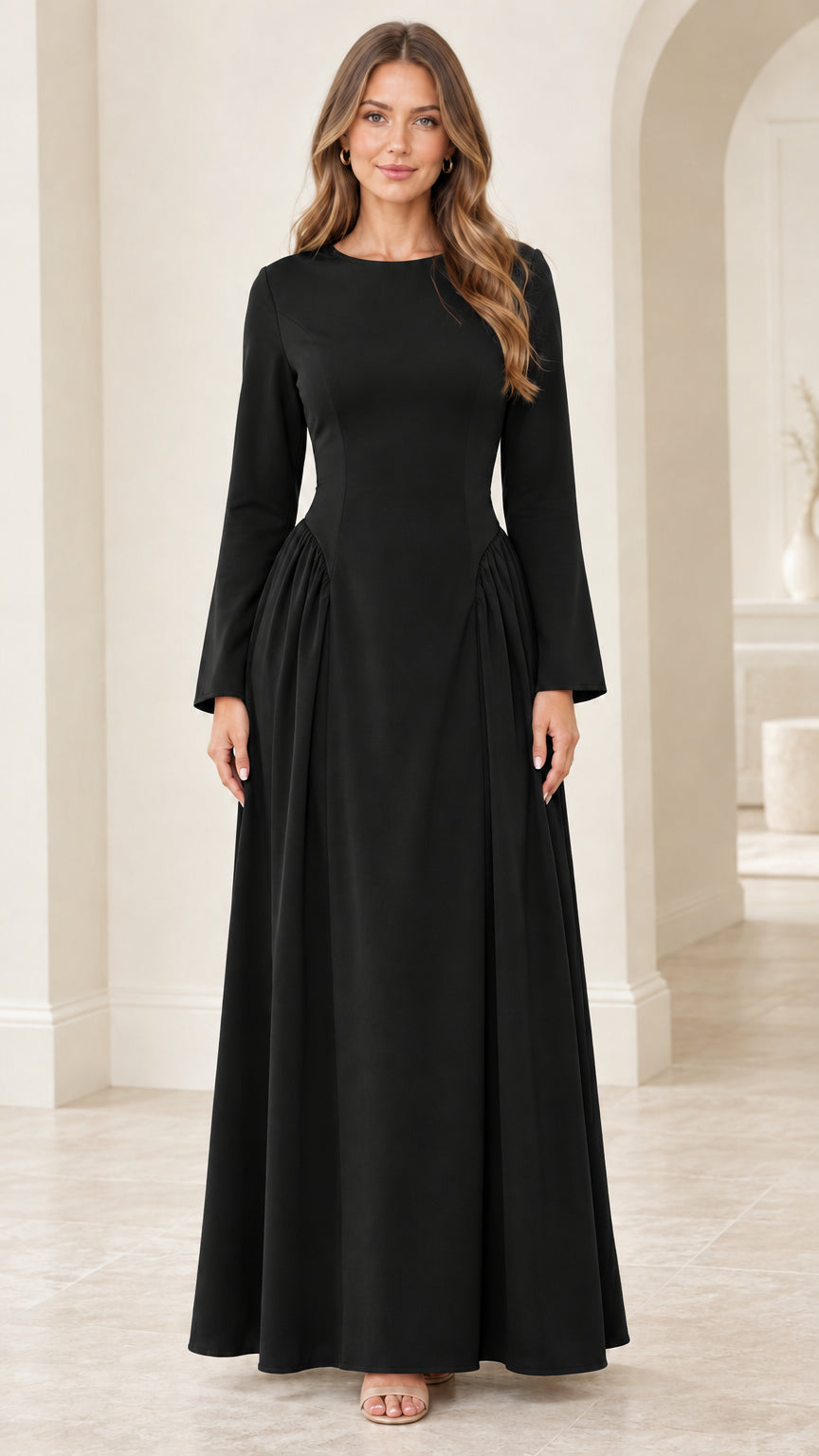 Front view of woman wearing black long sleeve lace-up back maxi dress