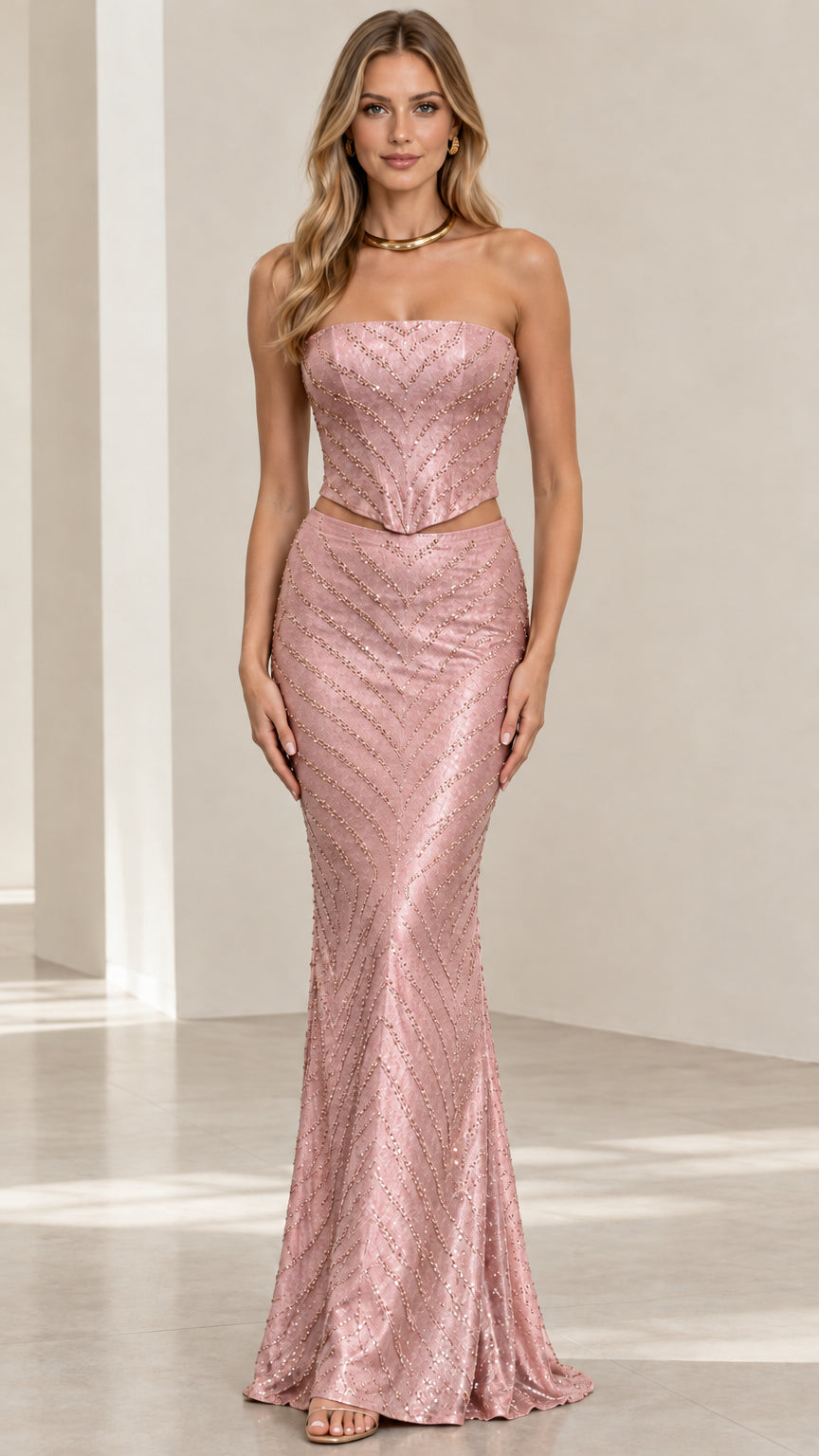 Front view of pink beaded strapless two-piece evening gown