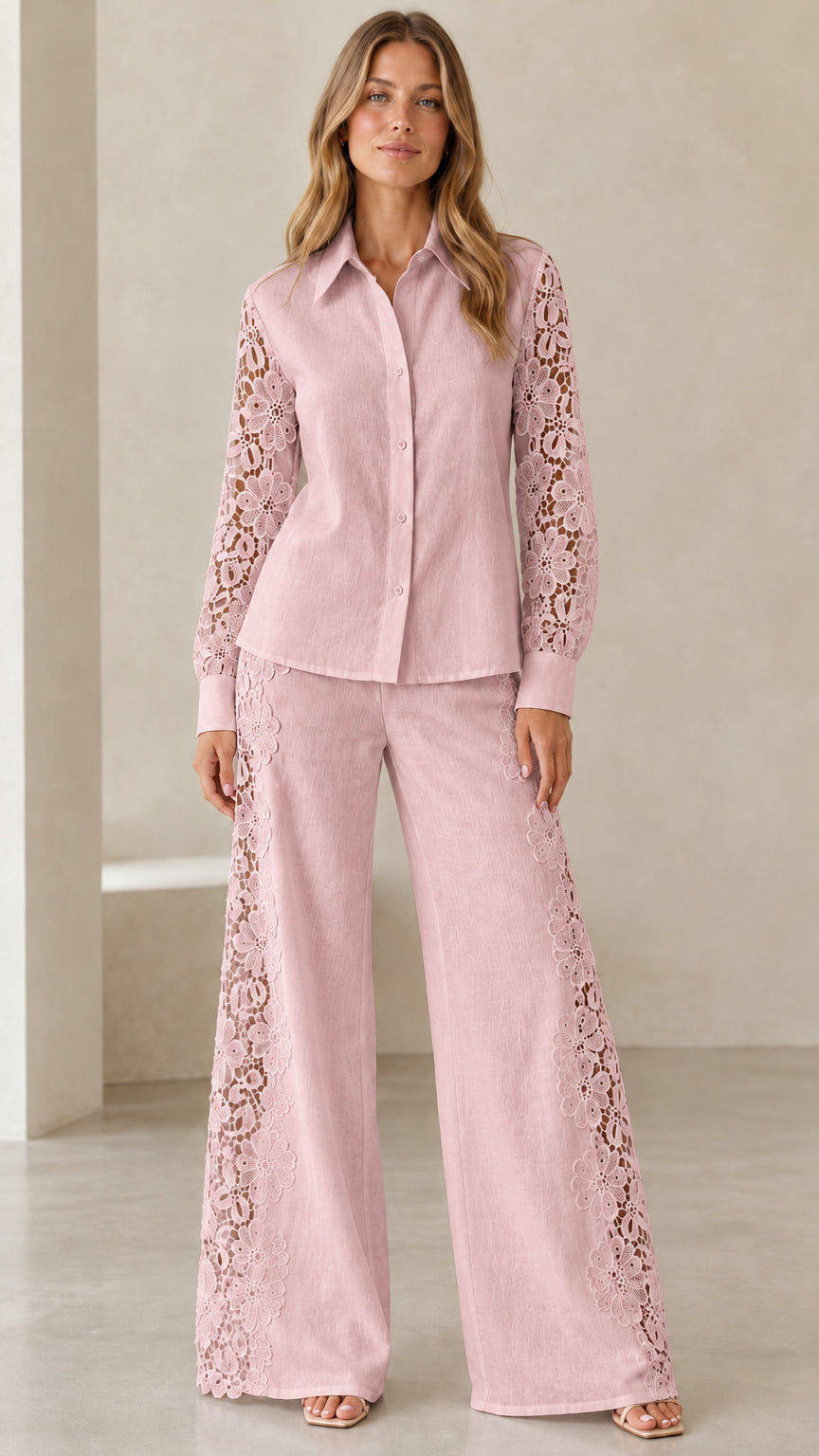 Front view of model wearing dusty pink lace-sleeve shirt and matching wide-leg trousers set