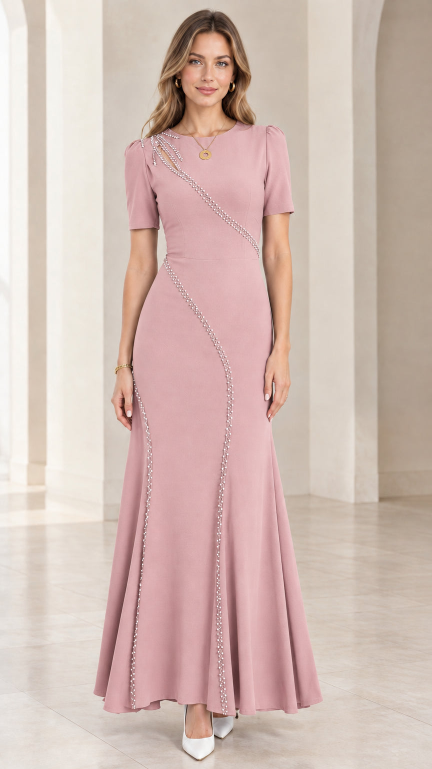 Front full-length view of dusty pink beaded cutout mermaid maxi gown