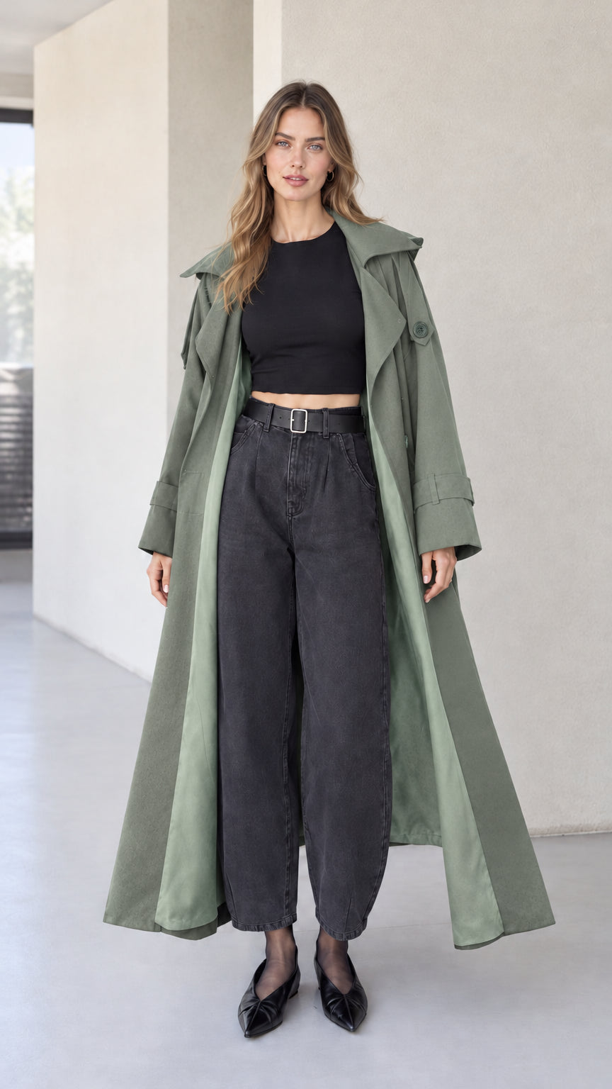 Full front view of sage green hooded maxi trench coat on model with dark denim